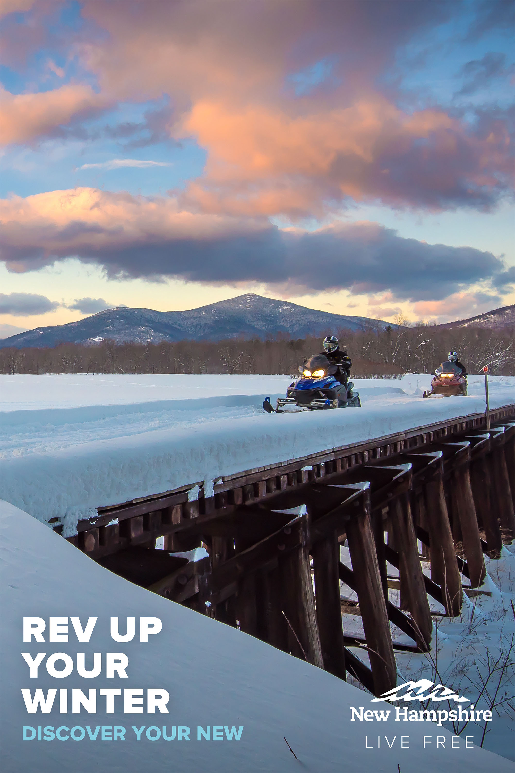 People riding snowmobiles