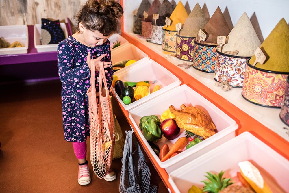 At the Children's Museum of New Hampshire in Dover, kids can "shop" in the One World Market for food, spices, musical instruments and more from Indonesia, India, and Mexico! Photo courtesy of taraphotography.com