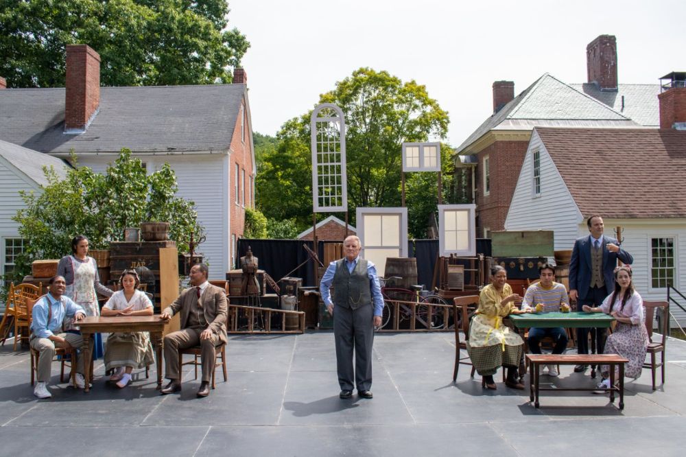 Thornton Wilder's Our Town, Summer 2021.  Photo Credit: Eric Rothhaus. Pictured are K.P. Powell, Aliah Whitmore, Madeline Kendall, Erick Pinnick, Gordon Clapp, Tracey Conyer Lee, Daniel Velez, Steven Michael Walters, Kate Kenney. Directed by Tom Frey. Scenic Design by Charles Morgan. Costume Design by Jane Alois Stein. Props Design by Emily Allinson. Lighting and Sound Design by Kevin Frazier. Stage Manager: Julia Perez. Assistant Stage Manager: Vanessa C. Hart.