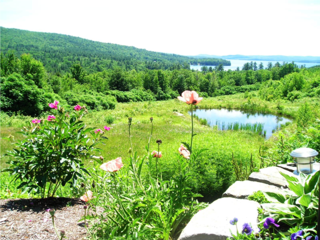 summer view with blooms over Newfound Lake from Coppertoppe Inn & Retreat Center