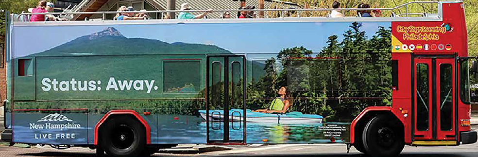 bus.png VisitNH Bus wrap with kayaker and mountain in background