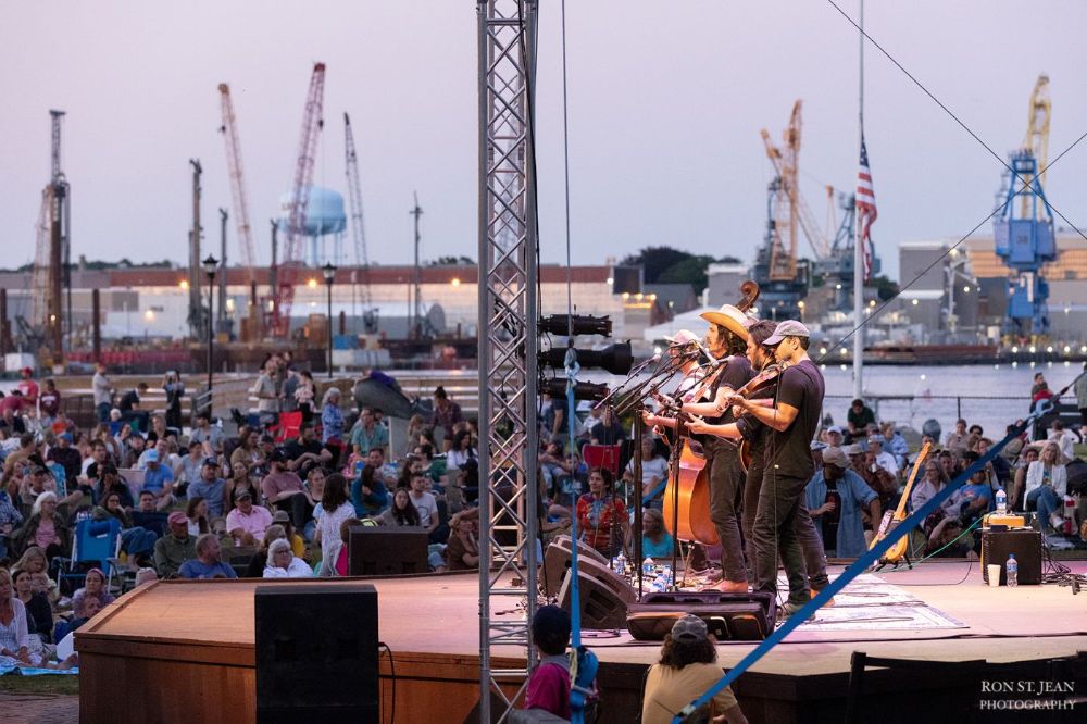 The Brothers Comatose play along the banks of the Piscataqua in 2022. Photo Credit: Ron St. Jean