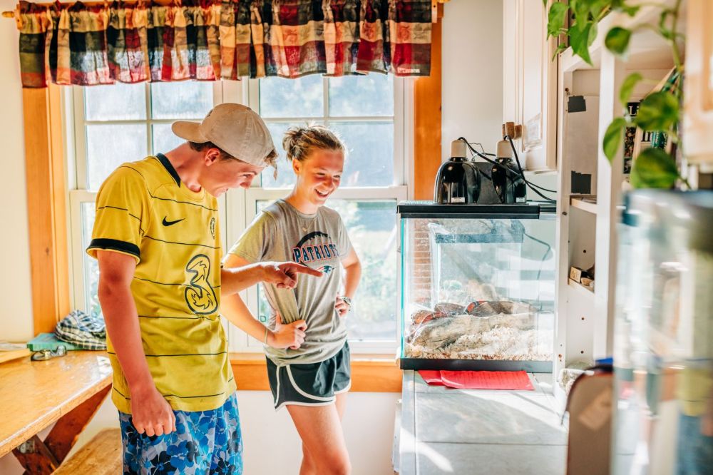 Checking out the naturalist station. Education is part of Appalachian Mountain Club's mission! Photo by Corey David Photography