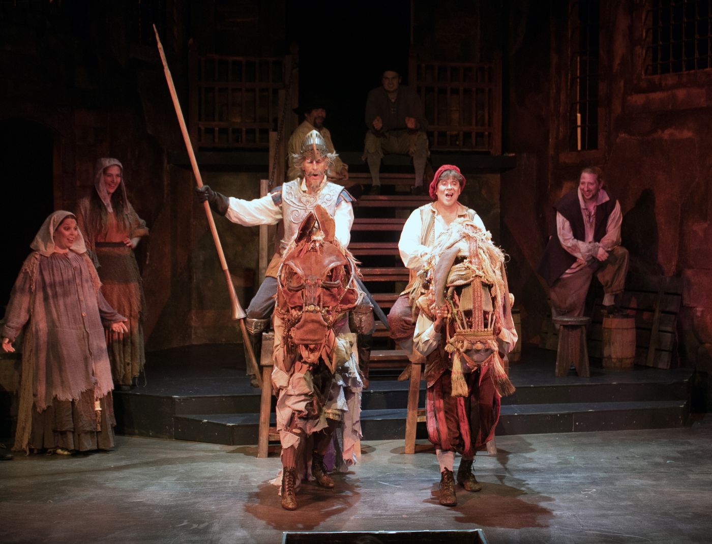 Man of La Mancha, book by Dale Wasserman, music by Mitch Leigh and lyrics by Joe Darion. Summer 2024. Photo Credit: Eric Rothhaus.  Pictured are Scott Bakula, Kraig Swartz, Lucy Zukatis and Christian Elan Ortiz.  Directed by Charles Morey . Choreographed by Patti D'Beck. Music Director Tim Goss . Scenic Design by Gary English. Lighting Design by Kevin Frazier. Sound Design by Alex Trombley. Costume Design by Jane Alois Stein. Wig Design by Kevin S Foster III. Props Design by Emily Allinson. 