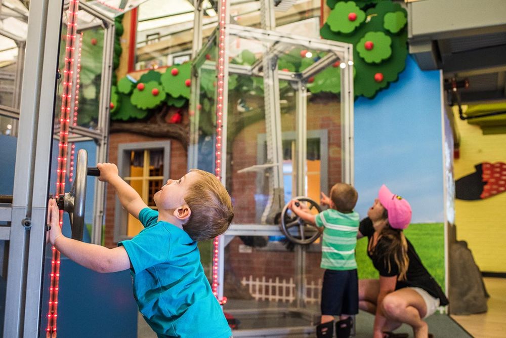 In the center of the Children's Museum of New Hampshire is the Build It, Fly It exhibit where kids can assemble a flying contraption, place them on a 30-foot vertical conveyer system and launch them into the air to see if they fly! Photo courtesy of Taraphotography.com