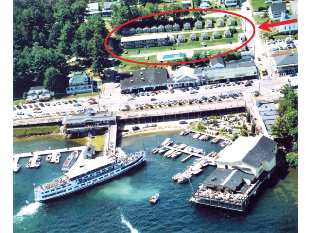 Aerial of Weirs Beach Center shows the location of the Half Moon Motel & Cottages circled in RED