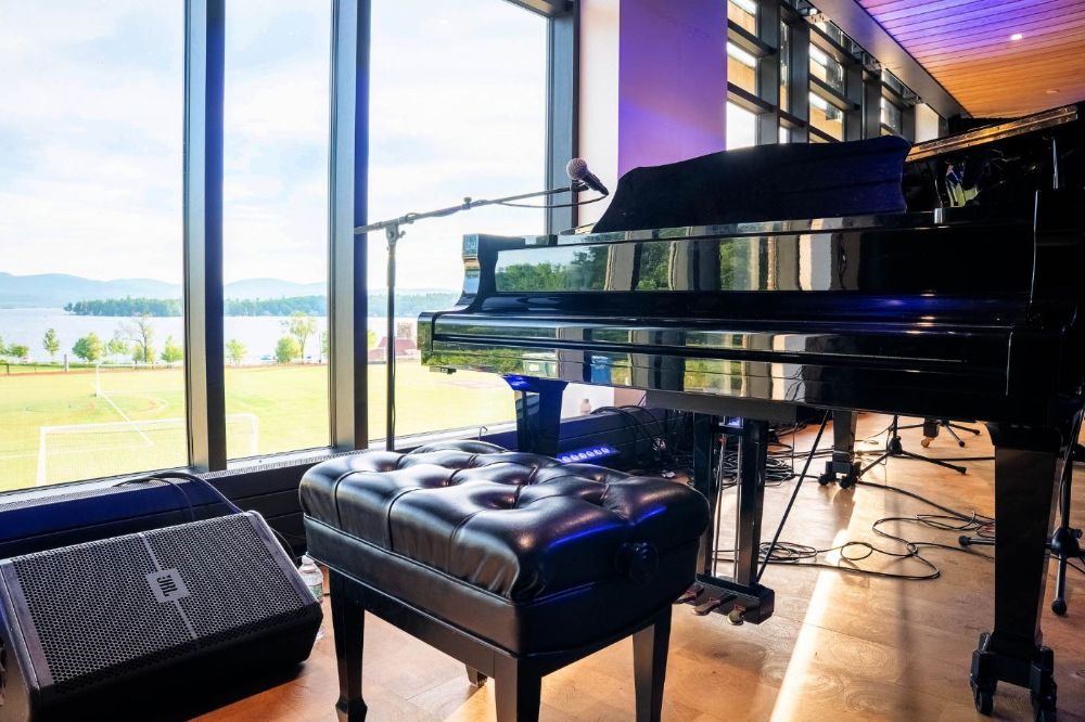Piano overlooking lake at Brewster's Student Center