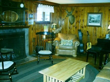 Relax by the wood fireplace in our living room, and play a tune on the Baby Grand piano or the guitars