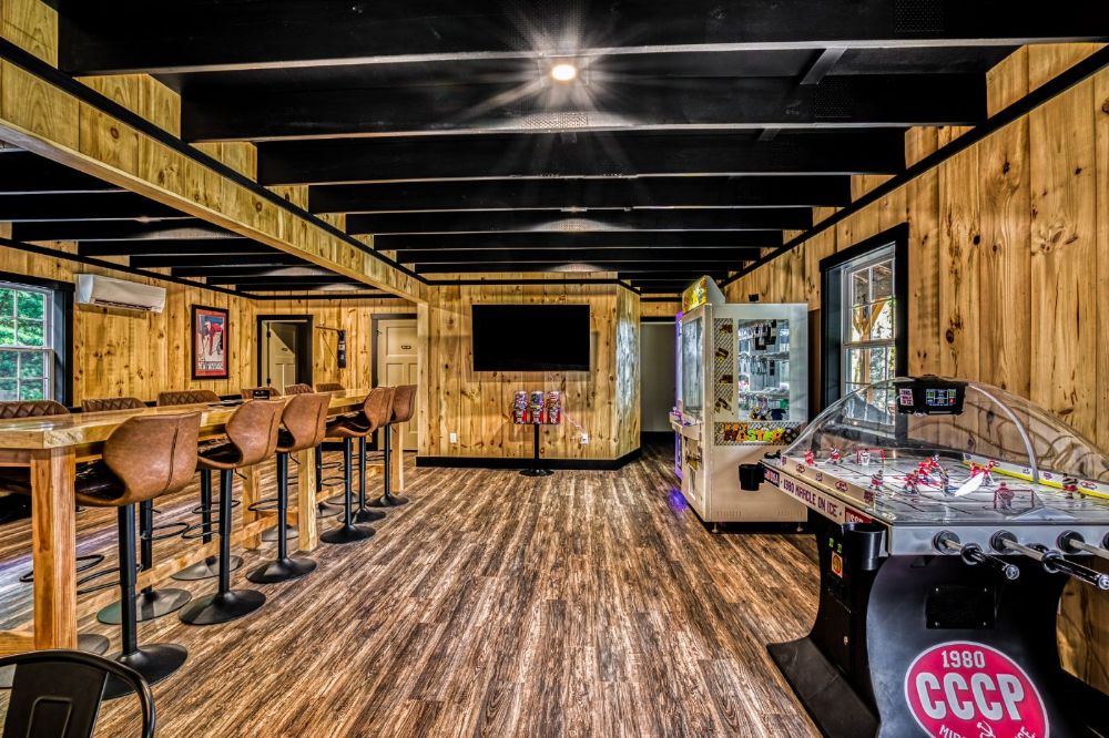 Game Room with contemporary and classic family games and movie room with large-screen TV.