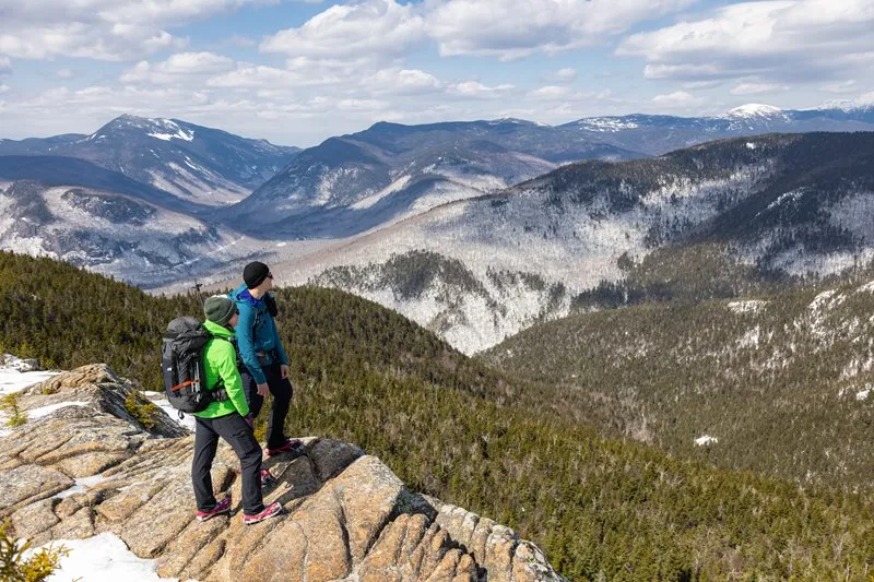 Couple standing at a scenic overlook on a hike